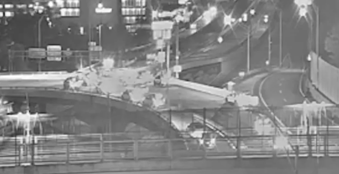 Police investigate a crash scene on Interstate 395 after a stolen vehicle pursuit