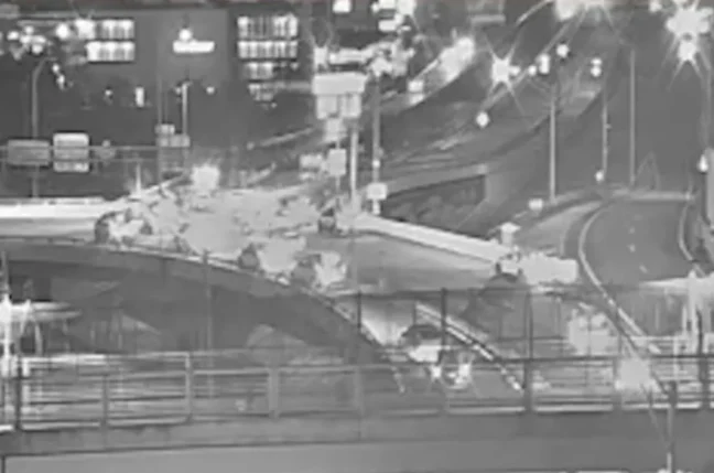 Police investigate a crash scene on Interstate 395 after a stolen vehicle pursuit