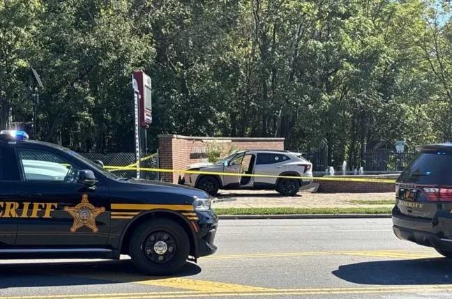 Investigators work at a Hamilton Avenue sidewalk crash scene where an SUV struck a pedestrian