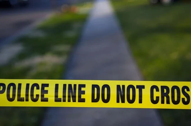 Police lights outside a residential home in Indiana after a reported shooting