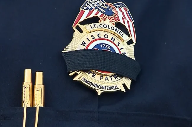 People gather at Chippewa Valley Bible Church in Chippewa Falls to honor Trooper Bradley Ritger