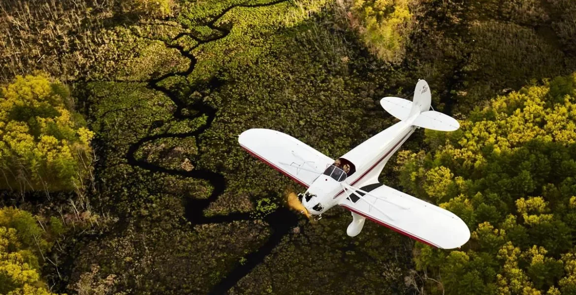 A small vintage airplane overturned after landing at Brunswick Maine Executive Airport