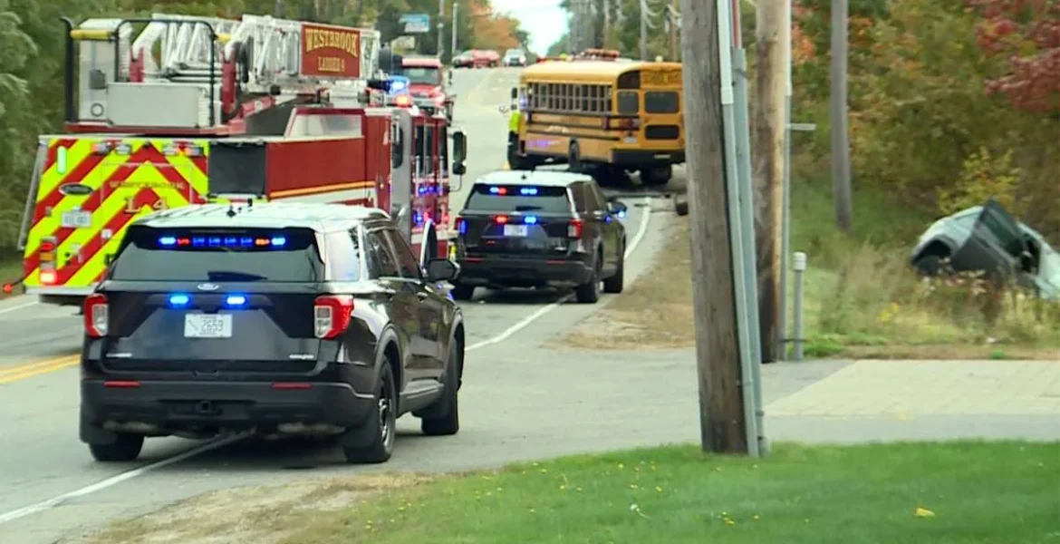 Damaged school bus and SUV in a ditch after a crash on Route 22 in Westbrook