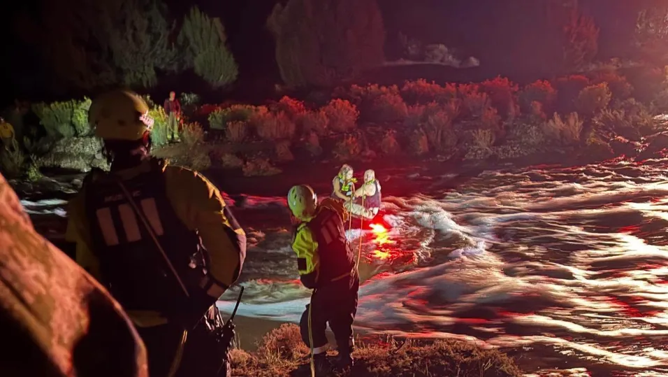 A National Guard swift-water rescue team responding near flooded water in San Miguel County