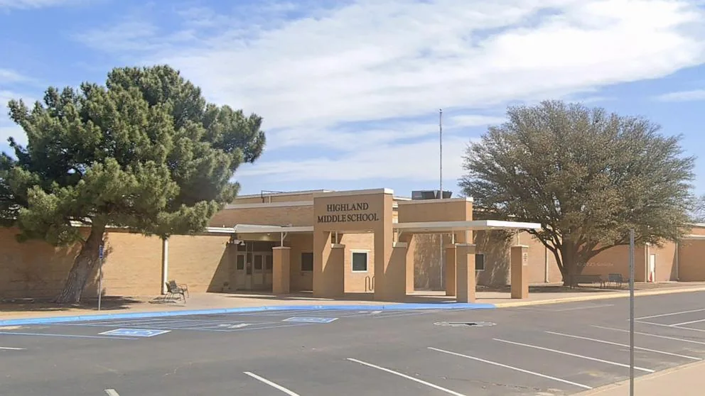 Police tape and officers outside Highland Middle School after a shooting in Hobbs, New Mexico