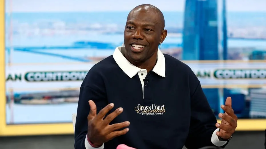 Terrell Owens speaks during a public appearance while a lawsuit over his online post moves forward
